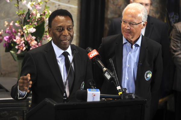 Pele and Franz Beckenbauer Light the Empire State Building